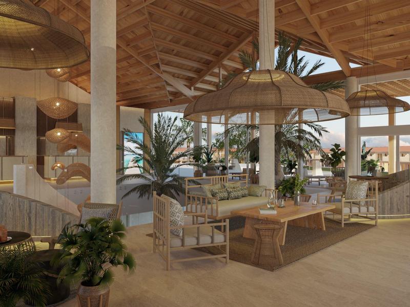 Spacious hotel lobby with wooden ceiling, large plants, and lounge seating areas.