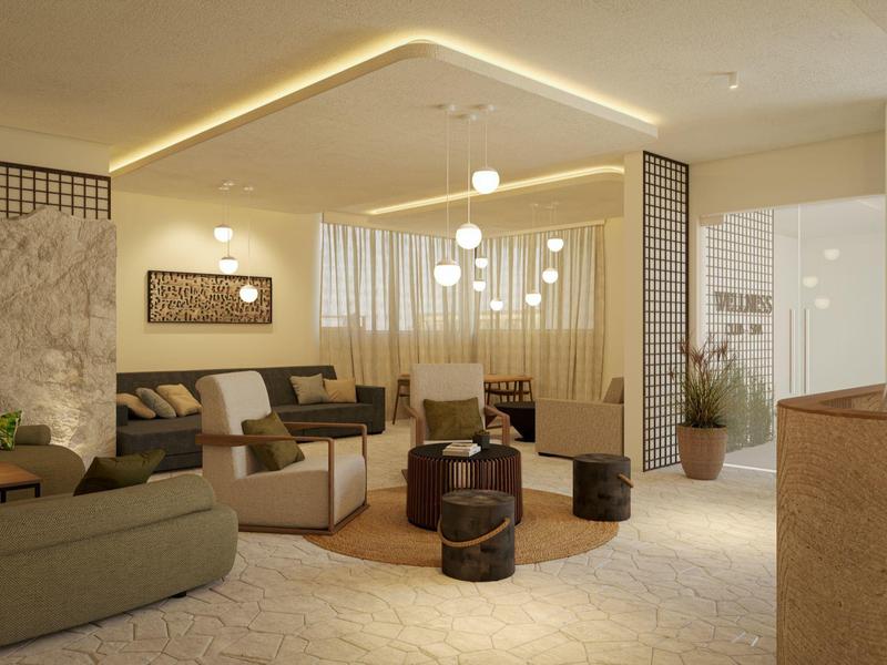 Cozy hotel lounge with modern seating, warm lighting, and decorative elements creating a relaxing atmosphere.