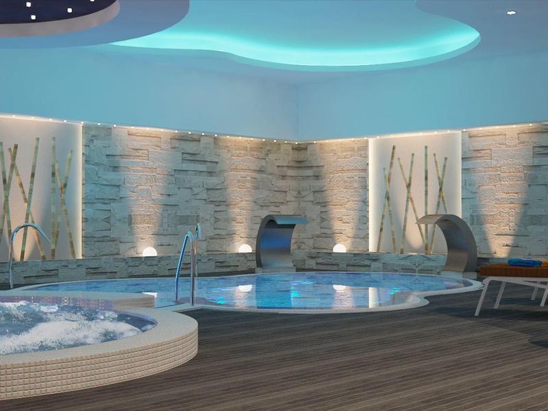 Area benessere moderna con piscina, vasca idromassaggio e illuminazione decorativa calda.