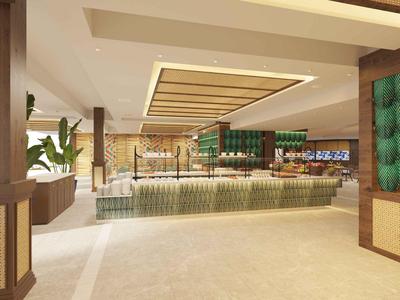 Ruime hotellobby met modern ontwerp, grote receptiebalie en groene decoraties.