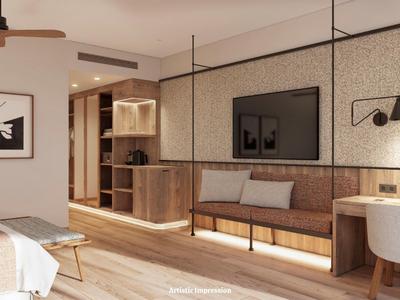 Camera d'hotel moderna con divano, TV e scrivania in toni caldi di legno.