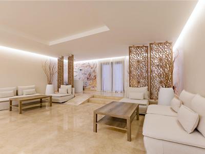 Bright modern lounge area with sofas, tables, and decorative partitions