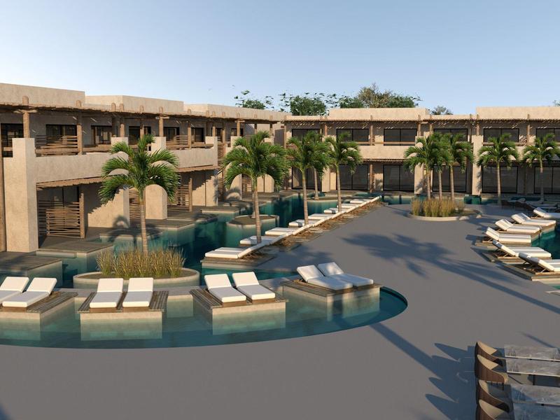 Espace piscine d'hôtel moderne avec transats, palmiers et bâtiment à deux étages en arrière-plan.