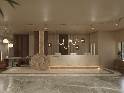 Área moderna de vestíbulo de hotel con recepción, asientos y luz natural.