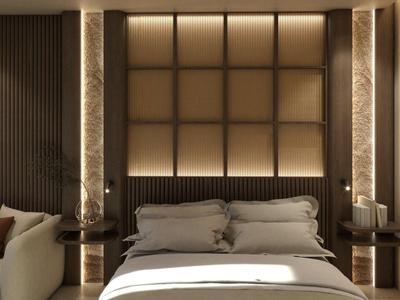 Dormitorio moderno con cama grande, almohadas suaves y luz indirecta en la pared.