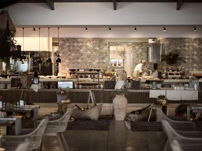 Modern café featuring wooden and stone elements, cozy seating areas, and a long counter.