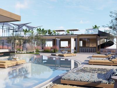 Complejo hotelero moderno con piscina, tumbonas y zona lounge abierta bajo cielo despejado.