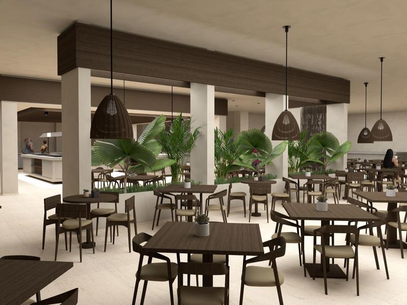 Modern café interior with tables, chairs, and green plants in a bright space.