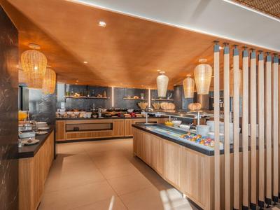 Modern kitchen with wood accents and hanging lamps