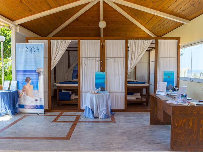 Hotel spa reception area with rustic wood design and spa treatment rooms