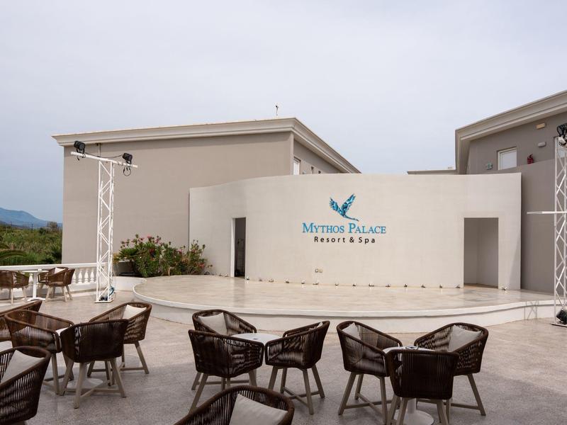 Modern outdoor area with seating and stage at Marino Palace hotel