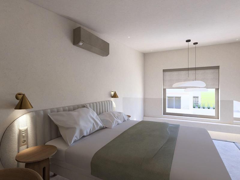 Moderne slaapkamer met klein raam, tweepersoonsbed en neutrale kleuren.