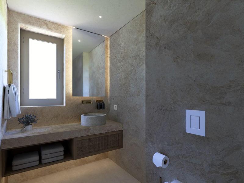 Moderne badkamer met raam, wastafels en grijze muren in een hotelkamer.