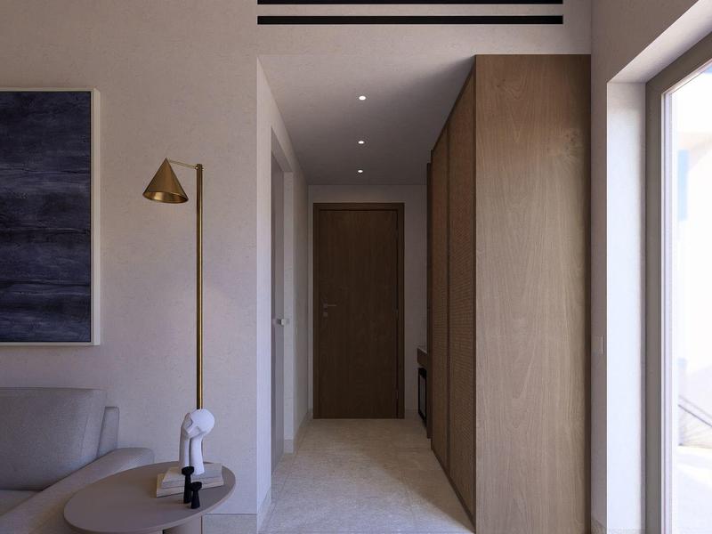 Moderne hotelgang met houtenkasten, bank en groot raam met uitzicht.