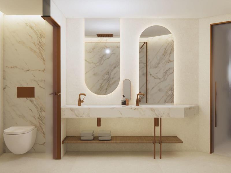 Moderne hotelbadkamer met dubbele wastafels, ovale spiegels en wandtoilet