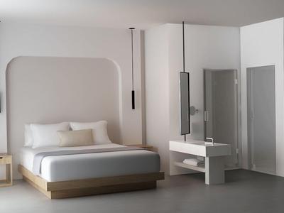 Camera d'hotel moderna con letto grande, comodino e design minimalista in tonalità neutre.