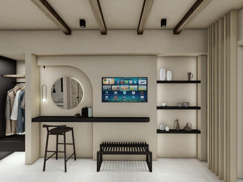 Chambre d'hôtel moderne avec un bureau minimaliste, un miroir et un banc aux couleurs neutres.