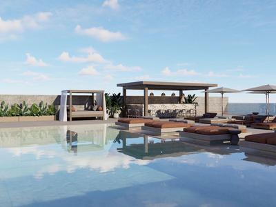 Moderní bazénová oblast s lehátky, altány a čistou oblohou v pozadí.