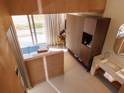 Moderner Hotelzimmer-Eingangsbereich mit Schrank, Spiegel und Tür zum Balkon.