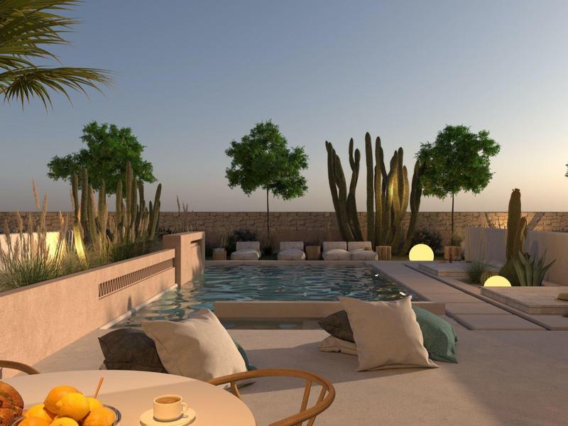 Lichte terras met gezellige zithoek, cactus tuin en klein zwembad bij zonsondergang