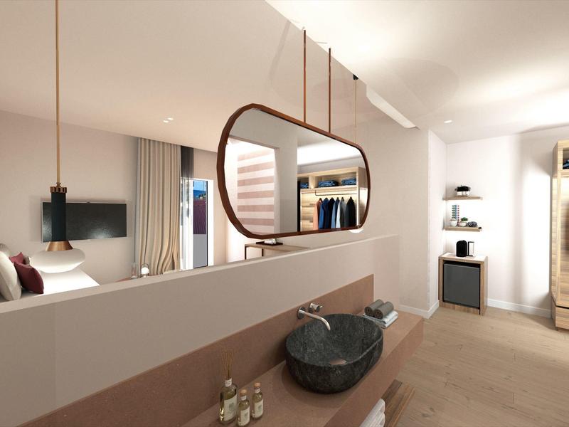 Moderně zařízený hotelový pokoj s otevřenou koupelnou a velkými okny.