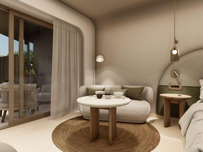 Modern bright hotel room with rounded furniture and access to terrace with pool