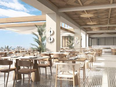 Bright, modern restaurant terrace with wooden chairs and sea view in sunlight.