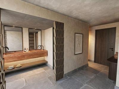 Modern hotel corridor with rustic design, wooden washbasin, and large mirror.