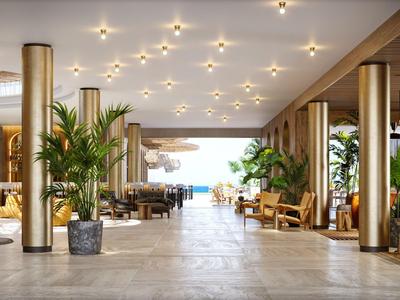 Luxuriöse Hotellobby mit Polstersesseln, Pflanzen und Blick auf das Meer.
