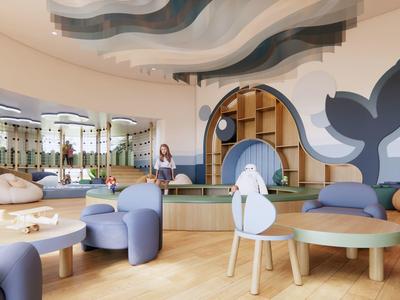 Kinderspielbereich mit weichen Sitzmöbeln und Wal-Design an den Wänden in hellem Raum.