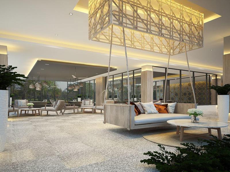 Moderne buitenruimte van hotel met hangende bank en lounge meubels 's nachts.