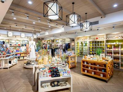 Cozy souvenir shop with shelves and counters filled with gift items.