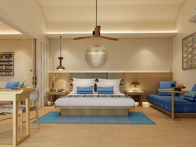Modern eingerichtetes Hotelzimmer mit Doppelbett, Sitzbereich und Holzboden.