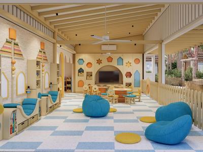 Hell gestalteter Indoor-Spielbereich mit bunten Sitzkissen und Wanddekorationen in einem Hotel.