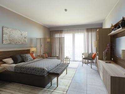 Modern hotel room with double bed, desk, TV, and large window with curtains.