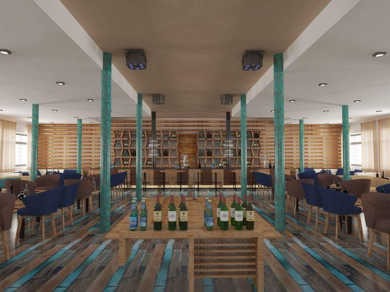Área de comedor moderna con sillas de madera y tapizadas en azul, grandes ventanas y botellas de vino en estantería.