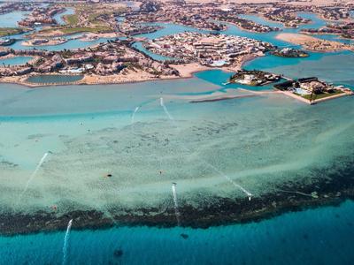 Aerial view of tropical islands with clear blue water and sandbanks.