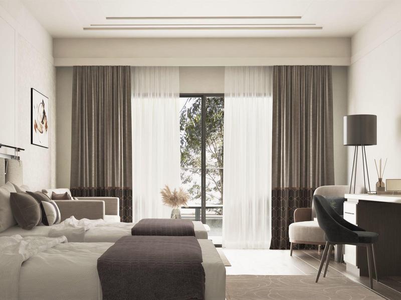 Modern hotel room with two beds, desk, and view of a balcony