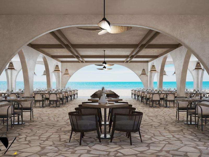 Open restaurant with sea view and paved floor under arched ceiling.