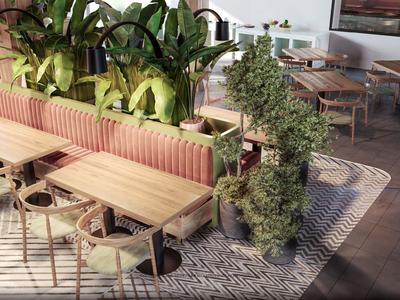 Restaurante moderno con sillas y mesas de madera y plantas verdes como separadores