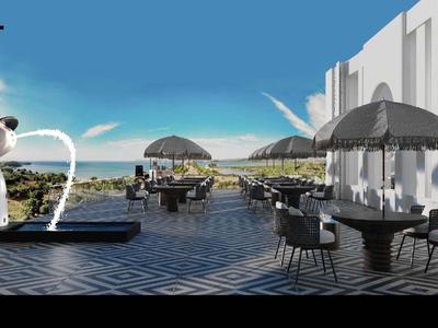 Moderner Außenbereich eines Hotels mit Sitzgelegenheiten, Sonnenschirmen und Blick aufs Meer.