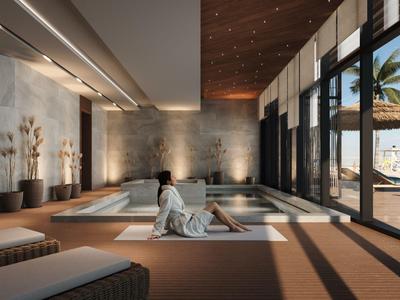 Ein moderner Spa-Bereich mit Sauna, großen Fenstern und Blick auf den Strand.