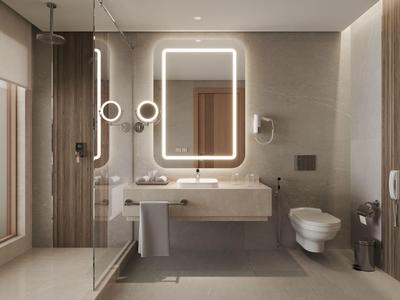 Modernes Hotelbadezimmer mit beleuchtetem Spiegel, Dusche und Holzakzenten.