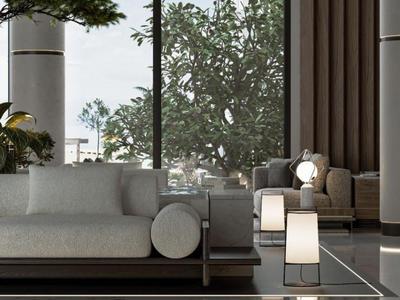 Modern hotelkamer met bank, fauteuils en grote ramen met uitzicht op bomen.