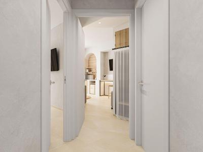 Blick durch einen offenen Türrahmen in einen hellen, modernen Raum mit Stühlen und TV.