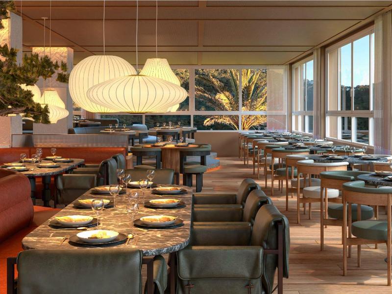 Salle à manger moderne avec grandes lampes et tables dans un cadre lumineux et accueillant.