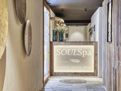 Bright spa reception area with wood and natural decor