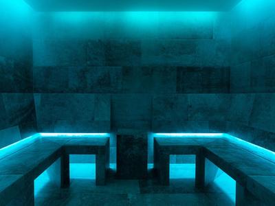 Dunkler Raum mit blauer LED-Beleuchtung und drei grauen Steinbänken an den Wänden.