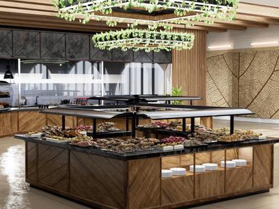 Area cucina moderna con mobili in legno e lampada sospesa con piante.