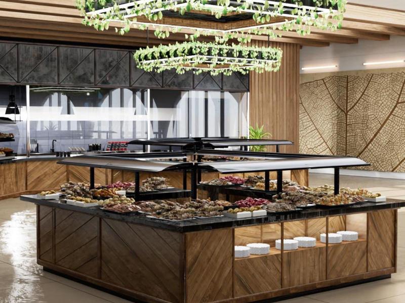 Area cucina moderna con mobili in legno e lampada sospesa con piante.